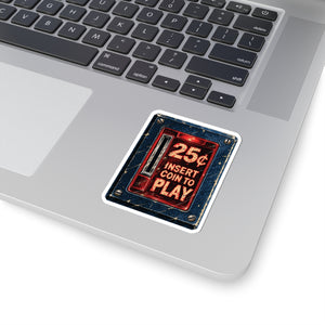 3 by 3 inch retro arcade coin door sticker applied to a laptop beside the keyboard