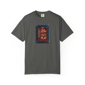 Pepper dark olive garment-dyed tee with a weathered arcade coin door graphic reading 25¢ insert coin to play