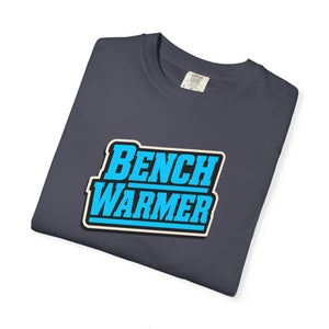 Detail shot of Bench Warmer Graphic Tee design — bold neon blue lettering and retro sport-card badge on garment-dyed cotton