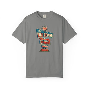 Granite gray garment-dyed graphic tee with an ink-line retro roadside sign reading The Rad Rewind, Memories, Now Playing, Always Open, front view