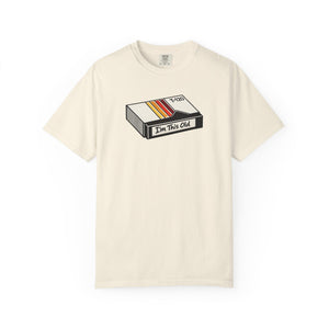 The Rad Rewind I'm This Old Graphic Tee — retro VHS cassette graphic on garment-dyed tee, front view
