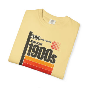 Butter yellow garment-dyed graphic tee with a retro cassette tape label design reading Made in the 1900s, folded