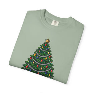 Bay sage green garment-dyed graphic tee with a pixel-art Christmas tree, colorful bulbs and silver garland, folded