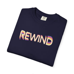 True Navy dark navy garment-dyed graphic tee with REWIND in retro echo-trail lettering trailing gold, pink and blue, folded