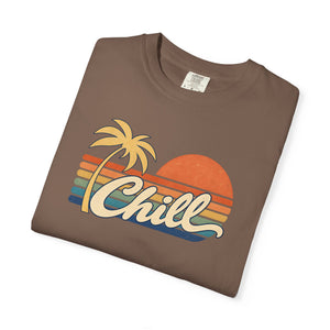Espresso brown garment-dyed graphic tee with a retro sunset, leaning palm tree, faded stripes and cream Chill script, folded