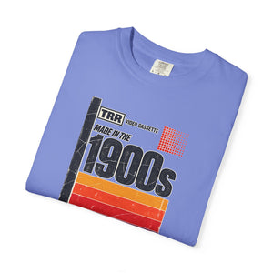 Flo Blue periwinkle garment-dyed graphic tee with a retro cassette tape label design reading Made in the 1900s, folded