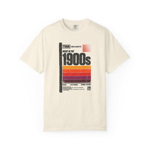 Ivory garment-dyed graphic tee with a retro cassette tape label design reading Made in the 1900s, front view