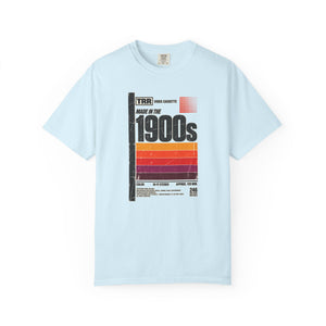 Chambray light blue garment-dyed graphic tee with a retro cassette tape label design reading Made in the 1900s, front view