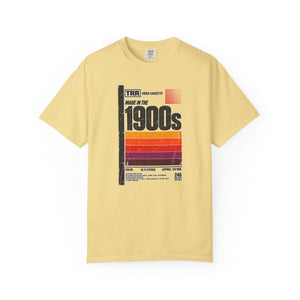 Butter yellow garment-dyed graphic tee with a retro cassette tape label design reading Made in the 1900s, front view
