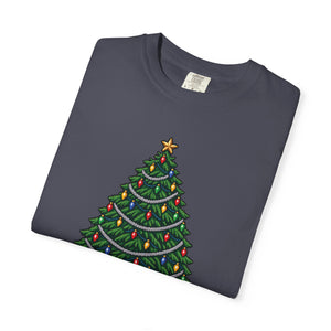 Navy blue-gray garment-dyed graphic tee with a pixel-art Christmas tree, colorful bulbs and silver garland, folded